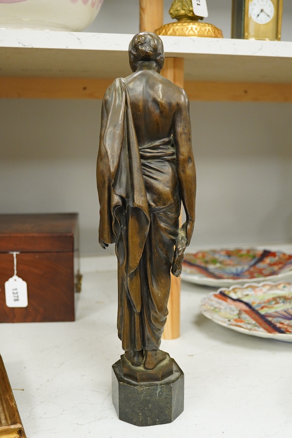 An early 20th century bronze figure of a classical maiden holding a laurel wreath, 46cm high. Condition - good